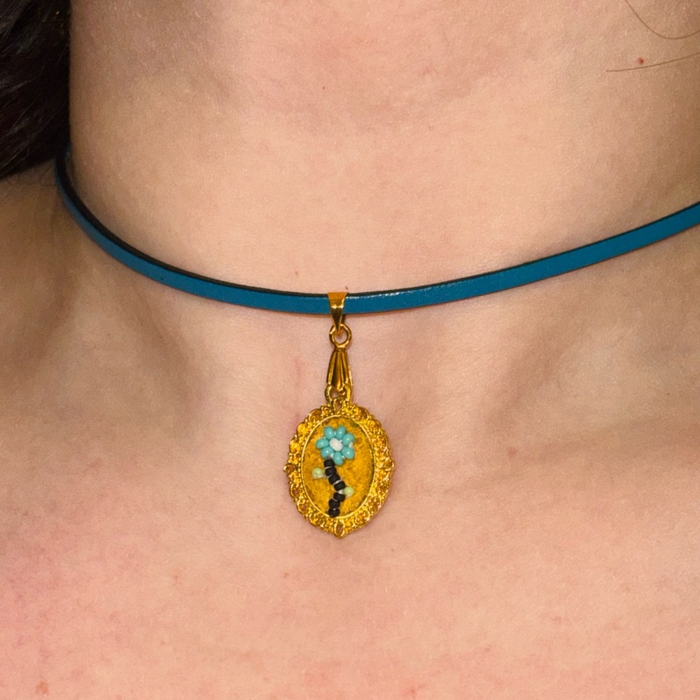 Blue leather choker with charm